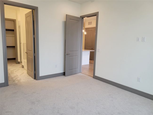 Unfurnished bedroom with light carpet | Image 11