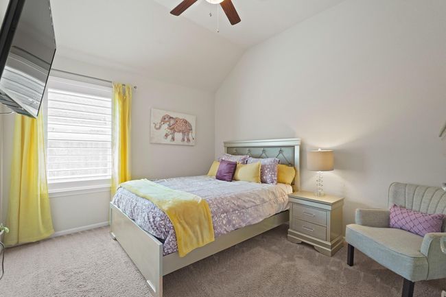 This inviting bedroom offers a serene sanctuary for relaxation or a personalized haven for creative expression. | Image 19