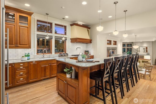 Impressive chef's kitchen featuring a 6-burner Viking Range, custom cabinetry and plenty of prep space to really spread out. | Image 8