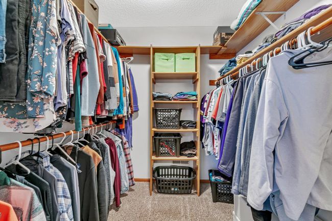 Primary walk-in closet with storage shelves | Image 14