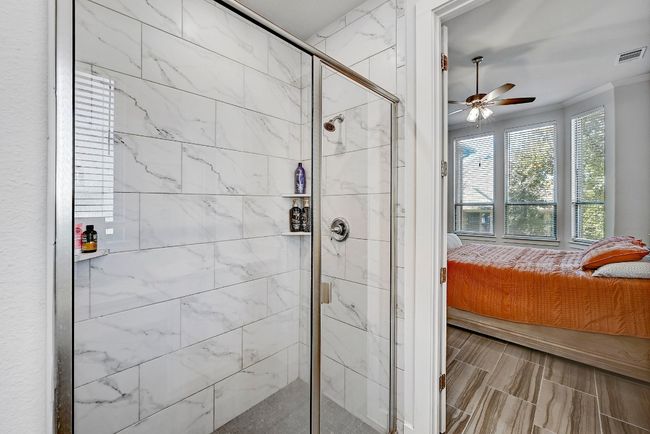 The oversized walk-in shower in the owner’s suite bathroom provides a calming, spa-inspired experience after a long day. | Image 15