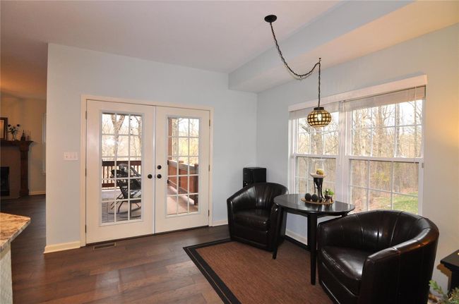 Breakfast nook w/double doors leading to private covered deck. | Image 14