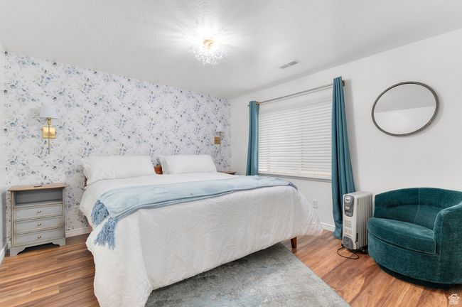 Large Basement bedroom with full size windows and a king sized bed. | Image 16