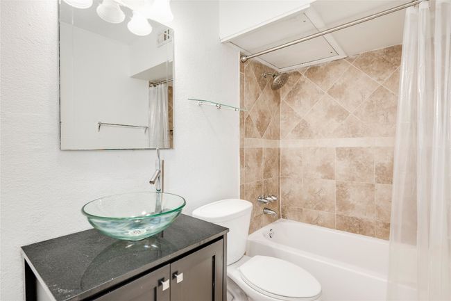 Full bathroom featuring vanity, shower / bath combo, and toilet | Image 37