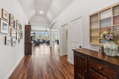 Inviting entry with soaring ceilings.Upon entering the home your eye goes through to the back windows at the living room. | Image 2