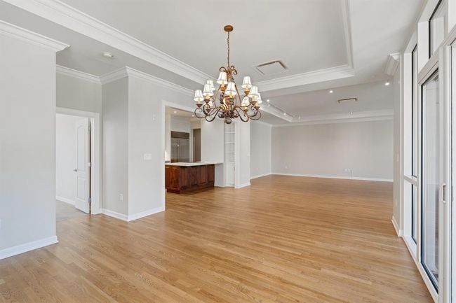 Dining room with the entry to the second bedroom on the left. | Image 17