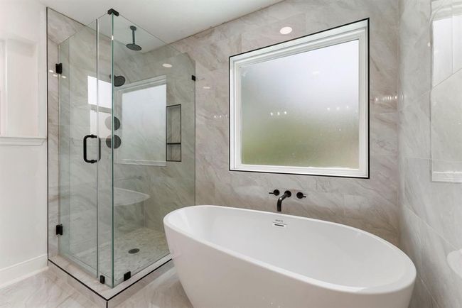 Elegant soaking tub and separate shower. | Image 18