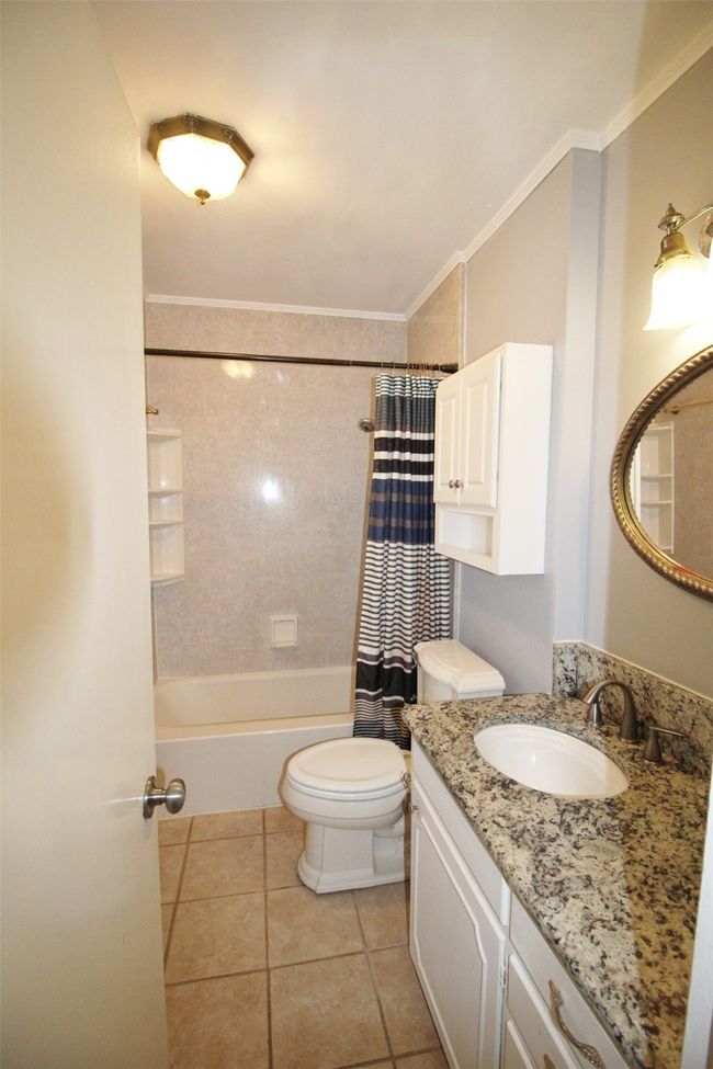 Granite counter top. Linen closet. Tub/shower combo | Image 20