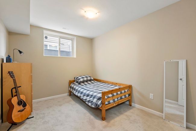 Bedroom featuring baseboards, carpet flooring, and visible vents | Image 29