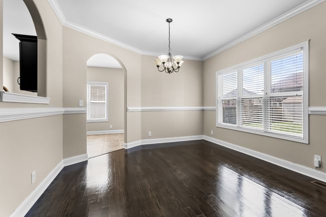 Formal Dining Room Features Chair Railing & Crown Molding! | Image 11