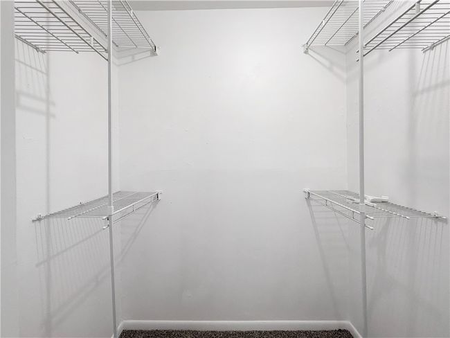 View of spacious closet | Image 12