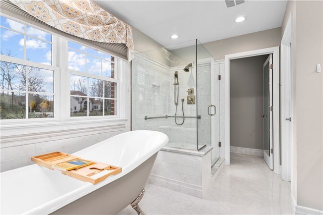 primary bath soak claw foot tub and separate walk in shower | Image 16