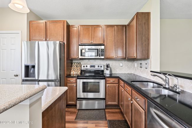 Sink on kitchen peninsula | Image 15