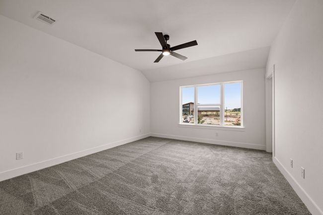 This dreamy owner's bedroom offers plenty of space and natural light. | Image 11