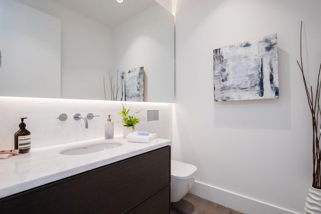Bathroom with vanity and wood finished floors | Image 19