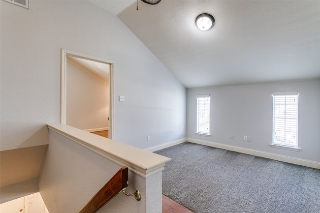 Spare room with vaulted ceiling | Image 16