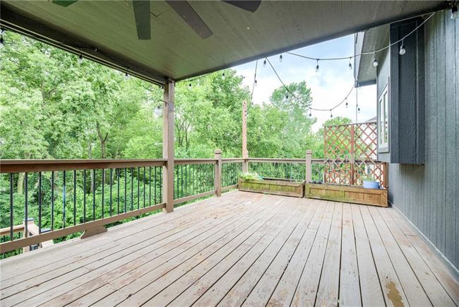Wooden terrace featuring a ceiling fan | Image 44
