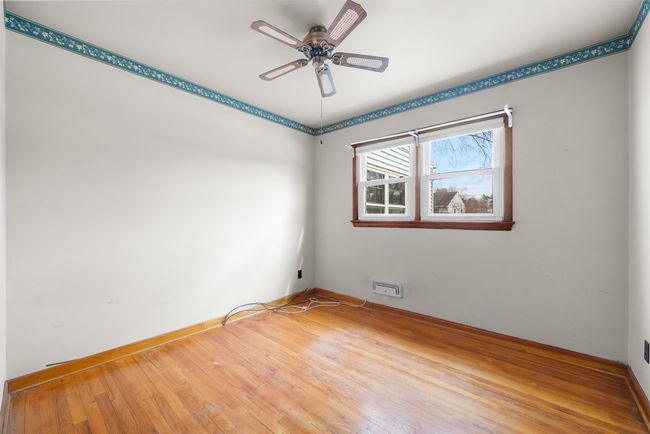 Empty room featuring baseboards, a ceiling fan, and hardwood / wood-style floors | Image 19