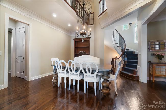 Dining room with built-ins is perfect for elegant dinner parties or casual gatherings | Image 15