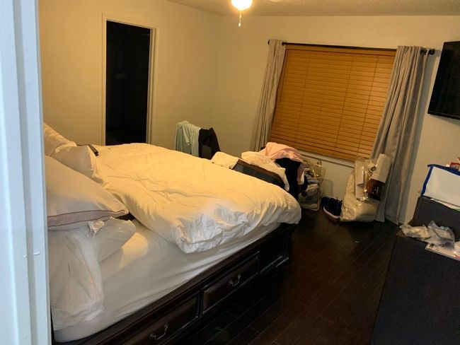 Bedroom featuring dark wood finished floors | Image 9