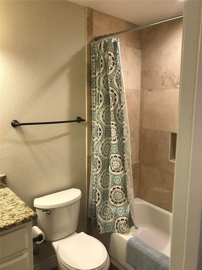 Full bathroom with toilet, vanity, and shower / tub combo | Image 7