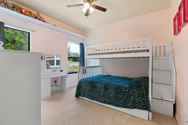 Bright, cheerful, and flexible—this secondary bedroom is ready for playtime, guests, or creative space. | Image 22