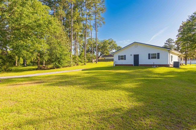 View of green lawn featuring central AC unit | Image 27