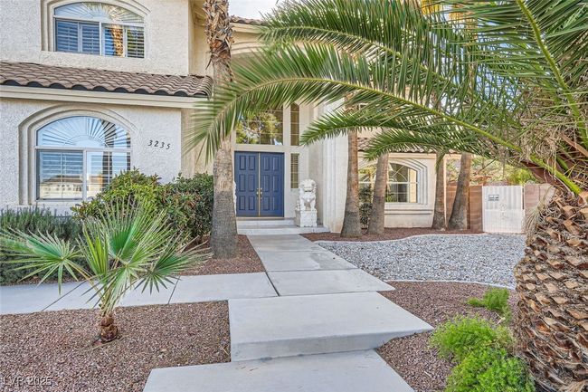 View of exterior entry with a tiled roof and stucco siding | Image 20