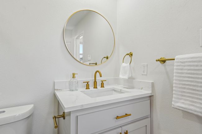 Half bathroom with vanity and toilet | Image 21
