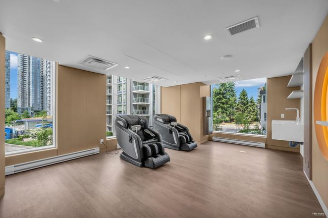 Interior space featuring a baseboard radiator, wood finished floors, healthy amount of natural light, and recessed lighting | Image 35