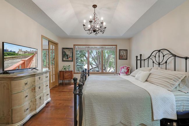 Owner's bedroom is spacious and elegant, with tray ceiling, gorgeous chandelier, and beautiful view. | Image 20