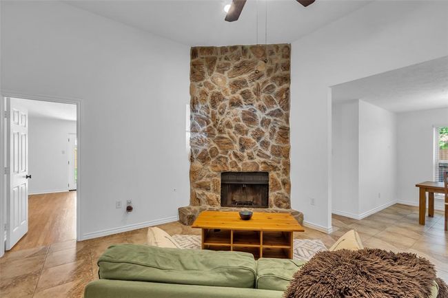 The door to the left leads to the primary bedroom. | Image 4