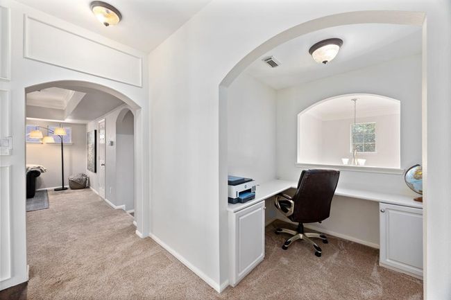 Upstairs nook with built-in desk is perfect for working from home or doing homework. | Image 35