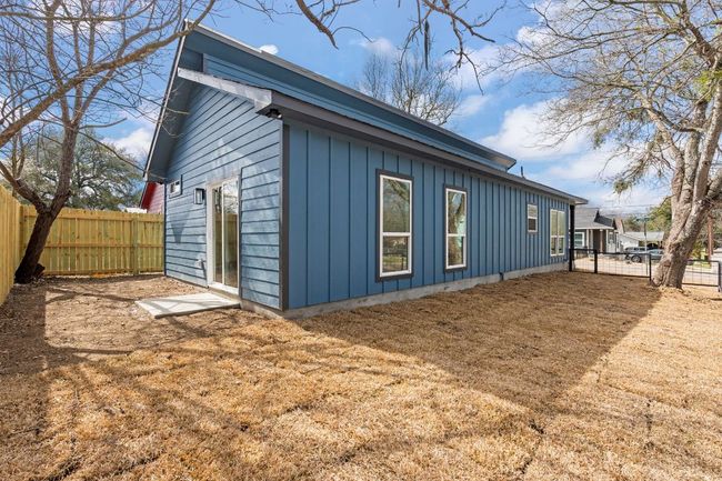 View of side of property featuring a fenced backyard and board and batten siding | Image 20