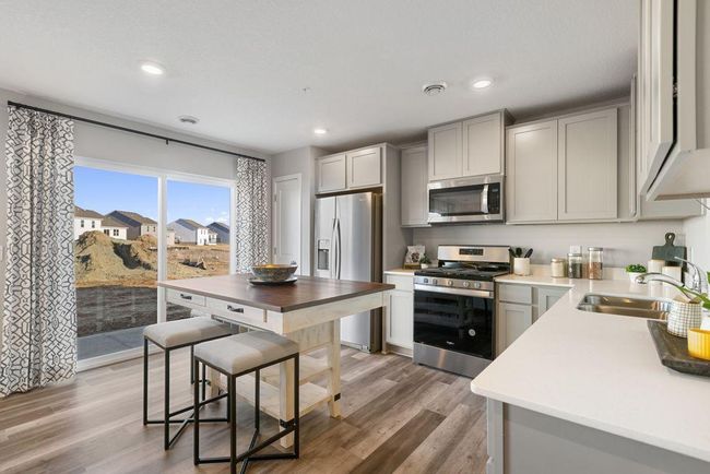 Lots of cabinets and pantry space will ensure that you have plenty of storage options. Photo is of model home. Colors and options may vary. Ask Sales Agent for details. | Image 4