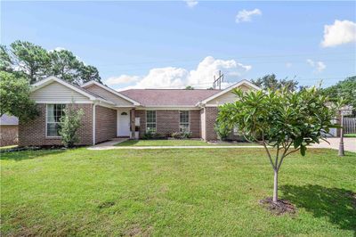 View of front of home featuring a front yard | Image 1