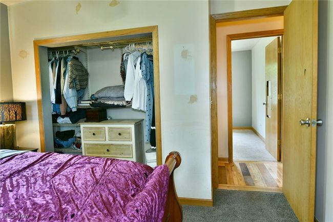 Carpeted bedroom featuring baseboards and a closet | Image 34