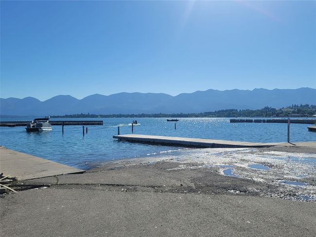 Dock area with a water and mountain view | Image 22