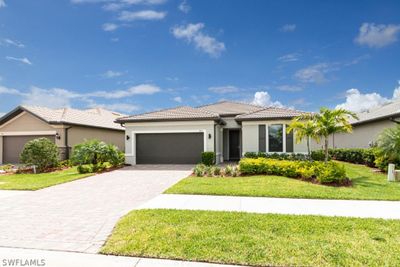 View of front of home with a garage and a front yard | Image 2