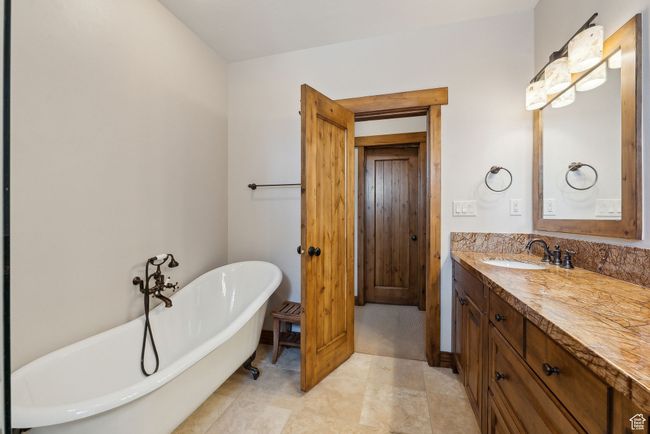 Bathroom with a freestanding bath and vanity | Image 19