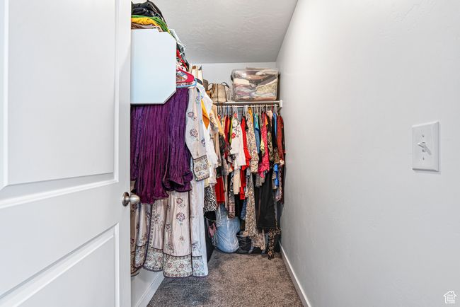 Spacious closet with carpet | Image 27