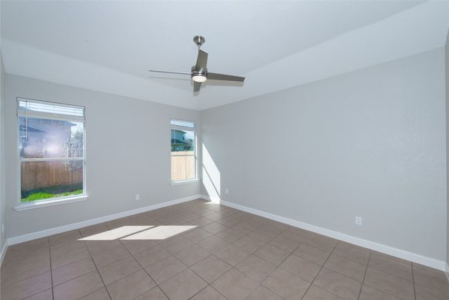 Primary bedroom facing rear of property and back yard | Image 10
