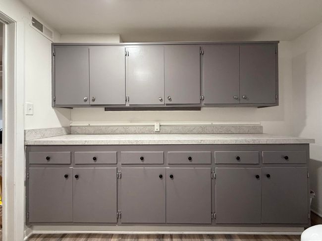 Enjoy a full counter and storage cabinets in your laundry room. W/D included. New Dryer Vent - 2025 | Image 40