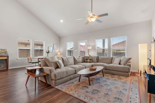 Open living area with vaulted ceiling. | Image 9