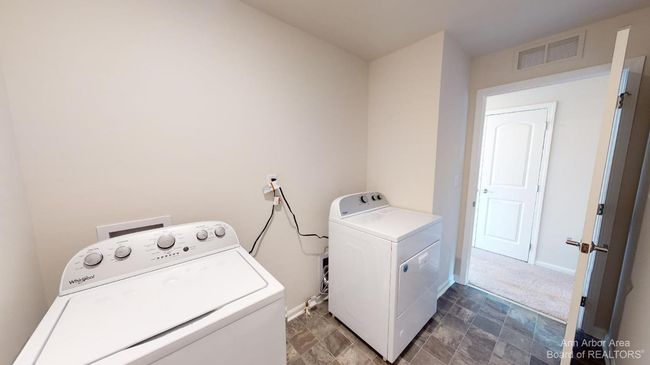 Upper level laundry room. | Image 21
