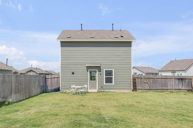 Back of house with a fenced backyard | Image 27