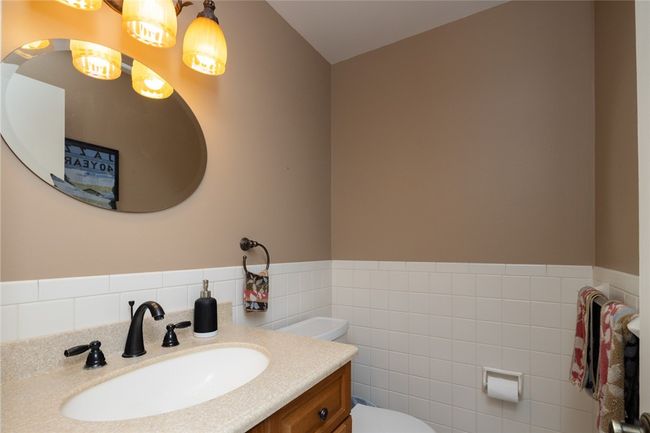 half bath is near the office and family room | Image 16