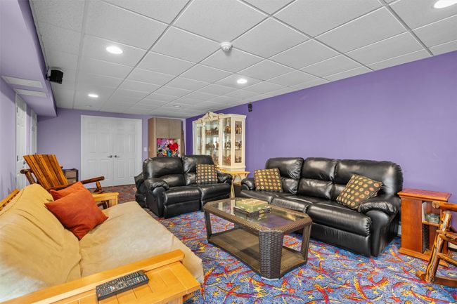 Living area with recessed lighting and a paneled ceiling | Image 28