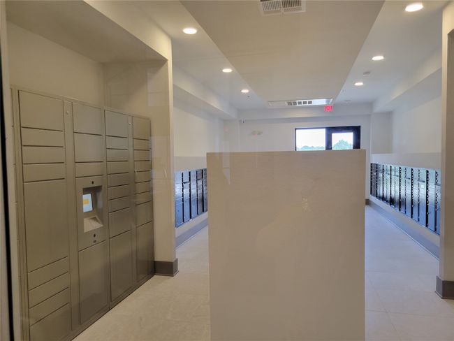 View of home's community with mail area, visible vents, and a package area | Image 35