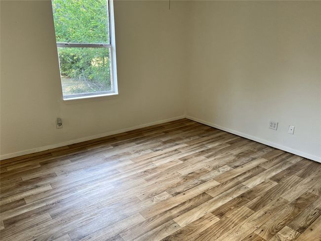 Unfurnished room featuring baseboards and wood finished floors | Image 9